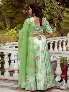 This Set Has Choli, Lehenga & Dupatta. Floral printed lehenga with organza sequins hand work dupatta. Color: Pistachio Green Fabric: Lehenga & Blouse- Satin Dupatta - Organza Product Details: Neck Type - Round neck Top Length - 14-15 inches Bottom Length - 40-42 inches Sleeve Length - 12 inches Note: The product will be delivered within 2-4 weeks of order placed Wash Care - Dry clean only Measurements: XXS : Chest = 32 | Waist = 28 | Hip = 34 XS : Chest = 34 | Waist = 30 | Hip = 36 S : Chest = 3