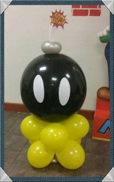 an inflatable balloon sitting on top of a table with a pacman face