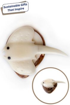 A cream-colored stingray figurine perched on a polished brown stone. Inset shows the figurine from a side angle. Caption reads “Sustainable Gifts That Inspire.