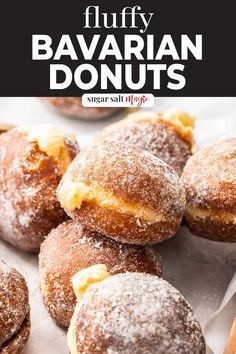 several sugared doughnuts are piled on top of each other with the words, fluffy bavaran donuts