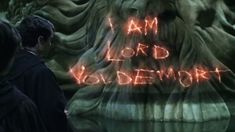 two people standing next to each other in front of a sign that says i am lord voldemot