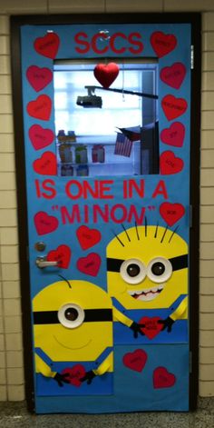 a door decorated to look like two minion faces with hearts and the words is one in a