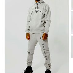 -Sold Out Online- An Essential For Any Streetwear Patron, A Hooded Tracksuit Has A Laid-Back Cozy Vibe That You Need To Keep Track Of. The Daily Drip Of Many A Rap, Trap, Sports Star, You're Gonna Want A Selection Of At Least 3 Boohoo Mens Tracksuits In Your Rotation. Look No Further, We Got You Mate, With Plain, Colour-Block And Graphic Printed Styles You Can Mix And Match For Infinite Fresh Looks. Details & Care 50% Cotton And 50% Polyester, Model Is 6'1" And Wears Size M Gray Fitted Athleisure Tracksuit, Winter Streetwear Sets With Pockets, Fitted Gray Athleisure Tracksuit, Hooded Streetwear Sets With Pockets, Hooded Streetwear Sets, Fitted Gray Tracksuit With Long Sleeves, Gray Fitted Long Sleeve Tracksuit, Fitted Gray Long Sleeve Tracksuit, Fitted Long Sleeve Gray Tracksuit