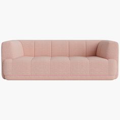 a pink couch sitting on top of a white floor