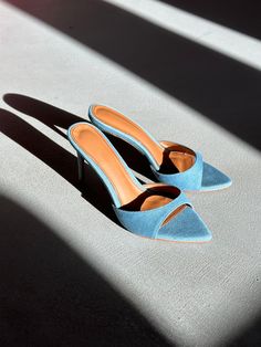 Gia is a minimal mule that will garner all the attention. Featured in Blue Denim with 80 mm heel (Also available in 120 mm). Size and Fit Information: U.S. Sizing Available in whole and half sizes Runs true to size (Some customers have sized up a half size since back is open) (Note: Not using leather and other materials from animals significantly reduces environmental impact, however, we acknowledge that synthetic alternatives are not without environmental concerns. As we grow, we are dedicated Environmental Concerns, Instagram Handle, Glass Slipper, Boot Pumps, Pumps Flat, Environmental Impact, Mule, Blue Denim, This Is Us