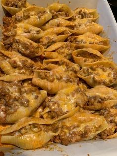 a casserole dish filled with meat and cheese