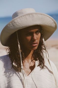 Made from 100% cotton canvas in a neutral beige tone, our new wide-brimmed holiday bucket is finished with a simple and secure necktie, ensuring this hat goes everywhere you do. Wide Brim Bucket Hat, Bucket Hat Design, Lack Of Color, Sun Protection Hat, Hat Design, Halo Style, Straw Hats, Wearing A Hat, Cotton Hat