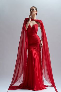 Description Red Mermaid, Long dress Cape shape, Long Sleeves Open neckline Dry Clean Evening Dress Made in EU CA71 Red Dress With Cape, Red Mermaid Gown, Red Silk Gown, Mermaid Long Dress, Dress With Cape, Red Christmas Dress, Evening Gowns With Sleeves, Designer Evening Gowns, Fashion Capsule