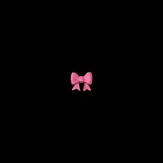 a pink bow on a black background