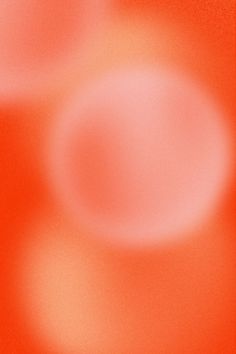 an orange and red blurry background with circles