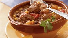 a bowl of stew with meat and vegetables