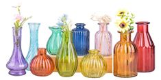 many different colored vases with flowers in them