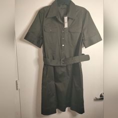 Here's The Details: - New-Nwt - Size: 12 - Color: Dark Green - Detail: Side Zip Pockets - Style Name: Safari Chore Dress - Short Sleeves - Button Down Front - Removable Belt - Stretch Material - Measurement Approx: - Flat Pit2pit: 20" - Full Length: 38" Great Condition No Price Is Final Feel Free To Make An Offer Please Look At All Photos. Disclaimer: Item(S) Are Represented To The Best Optics/Photos And Description Required For This Platform. Any Noticeable Flaws Are Noted In The Description. H Spring Workwear Dress With Snap Buttons, Fitted Button-up Dresses With Snap Buttons, Office Cotton Dresses With Buttons, Office Cotton Button Dress, Short Sleeve Dresses With Snap Buttons For Work, Fitted Collared Dress With Snap Buttons, Collared Workwear Dress With Snap Buttons, Collared Dress With Snap Buttons For Work, Workwear Dress With Snap Buttons And Collar