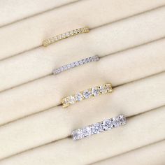 four different types of diamond rings sitting on top of each other