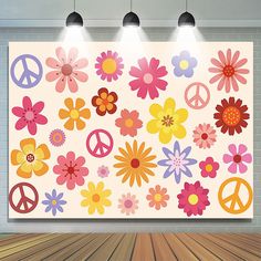 an image of flowers and peace signs on a wall with three lights above them that are hanging from the ceiling