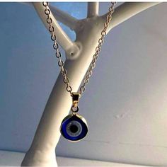 Elegant Gold Chain With A Striking Blue Evil Eye Pendant. Perfect For Any Occasion. Blue Jewelry With Chain And Round Pendant, Blue Jewelry With Round Pendant Chain, Blue Round Pendant Chain Jewelry, Blue Round Pendant Jewelry With Chain, Sterling Silver Blue Chain Jewelry, Sterling Silver Chain Jewelry In Blue, Blue Metal Jewelry With Adjustable Chain, Handmade Blue Jewelry For Everyday Wear, Handmade Blue Jewelry For Everyday