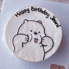 a birthday cake with a bear on it