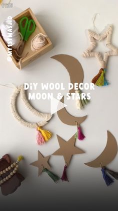 the diy wool decor moon and stars are made from yarns, scissors, beads, and paper