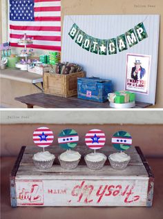 an old box with cupcakes on it and some flags hanging from the top