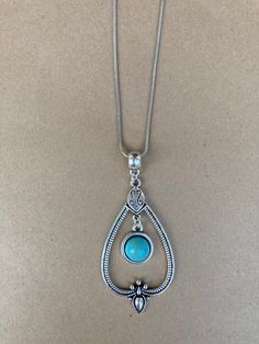 Simple yet Ornate Silver and Turquoise Pendant Necklace! Great for Everyday Wear! Elegant Silver Pendant Turquoise Necklace, Bohemian Turquoise Teardrop Pendant Necklace, Elegant Nickel-free Silver Turquoise Necklace, Elegant Adjustable Nickel-free Turquoise Necklace, Adjustable Nickel-free Turquoise Pendant Necklace, Nickel-free Sterling Silver Turquoise Necklace With Round Pendant, Turquoise Pendant Necklace, Turquoise Pendant, Pendant Necklaces