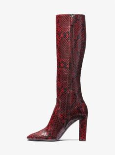 Statement boots dominated the Fall/Winter 2023 runway, and the Carly was undisputedly one of the most noteworthy offerings. Crafted from python-embossed leather, this towering pair features a sleek pointed toe and stands on a wrapped block heel for elegant height. A subtle side zip fastening makes for ease of wear while keeping the silhouette streamlined. Luxury Knee-high Boots With Reinforced Heel For Winter, Luxury Winter Knee-high Boots With Reinforced Heel, Luxury Knee-high Platform Boots For Formal Occasions, Luxury Leather Boots With Snake Print, Luxury Calf Leather Heeled Boots For Fall, Luxury Knee-high Platform Boots, Luxury Winter Formal Platform Boots, Luxury Formal Winter Platform Boots, Luxury Calf Leather Platform Boots For Fall