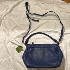 Kate Spade Navy Handbag Blue Crossbody Bag With Handles, Blue Crossbody Bag With Removable Pouch, Kate Spade Top Handle Satchel For On-the-go, Kate Spade Travel Satchel With Detachable Strap, Kate Spade Crossbody Shoulder Bag With Detachable Strap, Kate Spade Satchel With Detachable Strap For Travel, Blue Bag With Detachable Handle, Blue Crossbody Satchel, Shopping Crossbody Satchel With Handle Drop