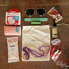 the contents of a purse laid out on top of a wooden table, including sunglasses and other items