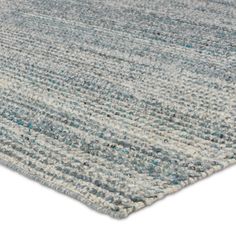 a blue and white area rug on a white background