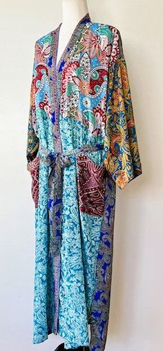 Luxury Silk Blend Kimono Duster: Elegant. This Kimono has a beautiful finish, printed on a classic patern. Creates depth, interest, and designer appeal. Luxurious fabric, soft, opaque. The perfect duster for cocktail parties, resort, beach or poolside cover-up. Adapts well to a duster coat or dress.A stunning mix of deep contrasting colors, turquoise, wine, pink, etc. Great gift for Easter, Mother's Day, Birthday, or just because you deserve it. Fabric is soft and drapes perfectly. Designed as a duster kimono with multiple style options. Wear open and flowing over a pantsuit, slip dress (looks incredible), belted as a cocktail dress. Material is opaque, pliable and holds it's shape.Definite designer look, elegant. You decide on the styling. Great for travel. Perfect for parties, summer, an Blue Printed Silk Kimono, Duster Kimono, Resort Beach, Kimono Duster, Cocktail Parties, Luxury Silk, Silk Kimono, Dress Material, Mixing Prints