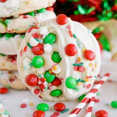 white frosted cookies with m & m candies and candy canes on top