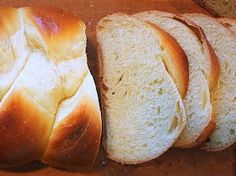 several loaves of bread sitting on top of a cutting board