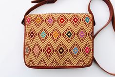 Beautiful embroidered Mexican Purses. It's one of a kind design and very versatile to use it every day. It's a great complement to wear with any outfits for any special occasion or everyday use. This lovely purse is embroidered on the front and the backside is plain. The Purse has 1 zippered compartment on top and a magnetic snap with a crossbody adjustable strap. It measures about 10x2x8″ inches. Find more colors and designs at https://www.etsy.com/shop/LatinxsCulturaViva?ref=simple-shop-header Brown Embroidered Satchel For Travel, Brown Embroidered Satchel For Daily Use, Daily Use Embroidered Brown Satchel, Brown Embroidered Shoulder Bag, Daily Use Brown Embroidered Satchel, Multicolor Embroidered Satchel Shoulder Bag, Embroidered Brown Pouch Shoulder Bag, Embroidered Brown Rectangular Satchel, Brown Embroidered Rectangular Bag