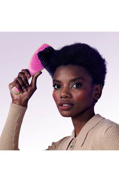 What it is: A detangling hairbrush in new bold and bright hues, made for use in the shower, featuring a handle and no-slip design. What it does: This brush detangles without pulling, tugging or snagging hair. Its teeth glide effortlessly through all types of wet hair, making for an easy and painless experience. Plastic Made in the UK Tangle Teezer, The Shower, Wet Hair, Hair Brush, Shower, Hair, Pink, Design