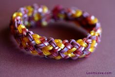 a close up of two bracelets on a table