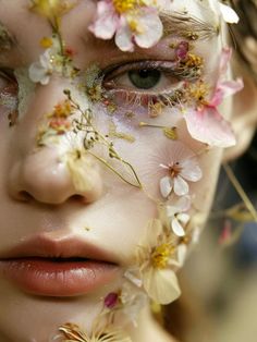 a woman with flowers all over her face