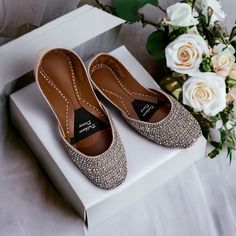 Introducing our Handmade Bridal Khussa with Crystal Embellishments - the epitome of elegance and comfort for your special day. 🌟 Embrace the Charm: Crafted with love and attention to detail, our bridal Khussa shoes are a perfect fusion of tradition and modern aesthetics. The delicate crystal embellishments add a touch of sparkle that will make you shine on your wedding day. 👑 Regal Comfort: We understand that every bride deserves to feel like royalty. That's why our Khussa shoes come with doub Crystal Embellished Flats For Wedding, Elegant Round Toe Flats For Reception, Elegant Flats With Round Toe For Reception, Elegant Wedding Shoes For Muslim Wedding, Elegant Closed Toe Flats For Reception, Elegant Flat Heel Wedding Shoes For Festive Occasions, Elegant Festive Flats For Formal Occasions, Elegant Formal Flats For Festive Occasions, Silver Closed Toe Flats For Wedding