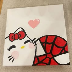 a hello kitty painting on a canvas with hearts