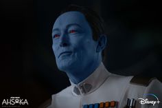 a star wars character with blue skin and red eyes