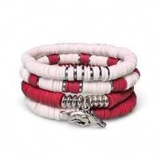 Celebrate your team spirit in style with our Crimson and White Game Day Bracelet Stack, a must-have accessory for fans who want to showcase their pride with elegance. This handcrafted bracelet stack combines deep crimson and crisp white polymer clay heishi beads, creating a bold and classic look that perfectly represents your love for the game. Each bracelet in the stack is meticulously crafted to ensure durability and comfort, making it ideal for wearing to the stadium, a tailgate party, or eve Cheap Red Bracelets For Game Day, Adjustable Red Stacked Beaded Bracelets, Adjustable Stacked Red Beaded Bracelets, Adjustable Stacked Red Bracelets, Red Adjustable Stacked Bracelets, Letter Bead Bracelet, Bead Bracelet Stack, Beaufort Nc, Letter Bead Bracelets