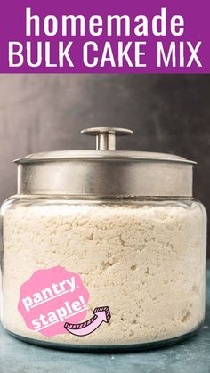 homemade bulk cake mix in a glass jar on a blue counter with text overlay