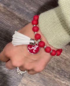 Adorable College Team Bracelets w/Tassel. Adjustable clasp. **Spend $50 or more & get FREE SHIPPING! **Spend $50 or more & have the option at check out to use Sezzle or Klarna for convenient payments. Casual Adjustable Tassel Jewelry, Adjustable Red Tasseled Jewelry, Adjustable Red Jewelry With Tassels, Tassel Bracelet Jewelry Gift, Team Bracelets, College Team, Mississippi State, University Of Alabama, Mississippi