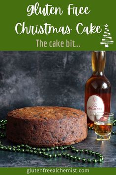 gluten free christmas cake on a table next to a bottle of alcohol and beads