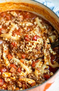 a large pot filled with pasta and meat