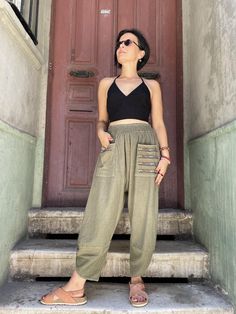 Crafted from high-quality, breathable cotton, our Bohemian Cotton Pants with Colorful Pockets offer the perfect blend of style and comfort. Designed for those who embrace a relaxed bohemian lifestyle, these elastic waist trousers feature a unique touch with colorful pockets, making them ideal for casual outings or lounging at home. Available in standard sizes S-L, they fit a variety of body types effortlessly. The versatile khaki tone adds a sophisticated touch to your wardrobe, while the relaxe Bohemian Bottoms With Side Pockets For Spring, Spring Bohemian Bottoms With Side Pockets, Bohemian Straight Pants With Pockets, Bohemian Straight Pants Bottoms With Pockets, Bohemian Harem Pants With Pockets For Summer, Bohemian Summer Harem Pants With Pockets, Bohemian Harem Pants With Pockets For Spring, Bohemian Long Pants With Side Pockets, Summer Harem Yoga Pants With Pockets