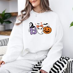 Halloween Ghost Sweatshirt, Boo Shirt, Spooky Ghost Hoodie, Spooky Season Ghost Sweater, Spooky Vibes Shirt, Halloween Gifts ORDERING: 1. Review all photos 2. Choose Size and Color from drop-down menu 3. If personalization box is available, add your text color 4. Add each shirt to cart one at a time 5. Click "Add to Cart" - you can go back to add more products 6. Click "Proceed to Checkout" 7. Add note to seller for any requests BULK DISCOUNTS AND SPECIAL REQUESTS: We offer bulk discounts and are open to special requests. Please feel free to direct message us with any inquiries. CARE INSTRUCTIONS: Wash inside out, gentle cycle, cold water, tumble dry low, medium iron. PRODUCTION AND SHIPPING: Processing time is next day. First Class Shipping is 2-5 business days (after processing time). If White Long Sleeve Fun Sweatshirt, White Fun Sweater For Fall, Fun White Sweater For Fall, White Halloween Hoodie Long Sleeve, White Halloween Hoodie, White Hooded Top For Halloween, White Long Sleeve Halloween Hoodie, White Long Sleeve Halloween Sweatshirt, White Long Sleeve Hoodie For Halloween