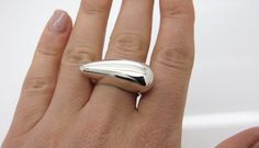 Silver chunky ring, Statement ring, Geometric ring, Sterling silver, Wide dome ring, Unique ring, Tear ring, Minimalist ring, Cocktail ring Βeautiful minimalist geometric design tear shape ring with polished finish. It is a perfect gift for yourself or for someone that you care for All our jewelry is HANDMADE 100% The material is 950 SILVER All my jewelry is safe and beautifully packed in elegant gift boxes and elegant gift bag We send our jewelry with FREE SHIPPING always with a TRACKING NUMBER Modern Pear-shaped Rings As Gift, Modern Teardrop Anniversary Rings, Minimalist Sterling Silver Teardrop Rings, Modern Silver Teardrop Ring, Minimalist Teardrop Ring For Everyday, Modern Teardrop Ring For Formal Occasions, Minimalist Teardrop Rings For Formal Occasions, Modern Pear-shaped Everyday Jewelry, Modern Silver Ring