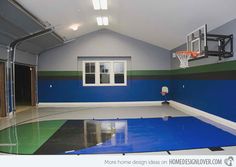 an indoor basketball court with blue and green paint