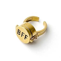 The Perfect Gift For Your BFF Wear it as a reminder of the endless laughter, inside jokes, and adventures you've shared together!Our Best Friends Forever Ring is fully adjustable, making it a perfect fit for most finger sizes. Specifications PRODUCT DETAIL Opens, spins, locks Weight: 10g MATERIAL Metal alloy 24K gold plated SIZE & FIT Size: Adjustable 5-10 Face: 17mm FEATURES Engraved lettering Shiny gloss finish Personalized Adjustable Rings For Friendship, Adjustable Personalized Rings For Friendship, Forever Ring, Cuban Necklace, Diamond Chain Necklace, Forever Rings, Miami Cuban, Free Socks, Free Bracelet