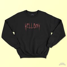 "Hellboy Goth Sweatshirt (Lil Peep Hoodie, Plus Size Goth, Goth Clothes, Lil Peep Sweatshirt, Emo Crewneck, Alt Clothing, Mall Goth) 💜 Hello there! Add some personality and style to your wardrobe with this \"Hellboy\" unisex goth sweatshirt, or give it as the perfect gift! A sturdy and warm sweatshirt bound to keep you warm in the colder months. A pre-shrunk, classic fit sweater that's made with air-jet spun yarn for a soft feel and reduced pilling. 📝 PRODUCT INFORMATIONS: * 50% cotton, 50% polyester * Pre-shrunk * Classic fit with no center crease * 1x1 athletic rib knit collar with spandex * Air-jet spun yarn with a soft feel and reduced pilling * Double-needle stitched collar, shoulders, armholes, cuffs, and hem" Grunge Hoodie Top With Letter Print, Grunge Hoodie With Letter Print, Grunge Letter Print Hoodie, Emo Winter Streetwear Tops, Winter Emo Streetwear Tops, Emo Style Winter Streetwear Tops, Alternative Halloween Hoodie With Letter Print, Alternative Style Halloween Hoodie With Letter Print, Black Halloween Sweatshirt For Alternative Fashion