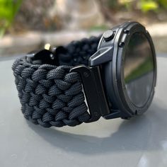 "Handcrafted with 100% Nylon Paracord \"MADE IN USA\".   ⚠️GARMIN FENIX 7, TACTIX 7, QUATIX 7, MARQ (Gen 2) AND EPIX (Gen 2) MUST INCLUDE QUICK RELEASE or HEMSUT ADAPTERS as the original metal bar is not removable (Included in price). ⚠️Please, make sure you are able to remove the spring or metal bar from your watch before requesting \"No Adapters\". ⚠️Hemsut adapters not compatible with Instinct watches. Our Products include:    ➖Custom handcrafted watch bands \"According to You\". No matter how small or big your wrist size, we will craft your perfect fitting band (wrist size picture measurement required).  ➖Variety of styles to choose from. You may order your band \"As pictured\", or feel free to request changes. If you don't see your favorite style in our page or watch category yet, ple Functional Wear-resistant Watch Accessories For Outdoor Activities, Durable Outdoor Functional Watch Bands, Durable Functional Outdoor Watch Bands, Durable Functional Watch Accessories For Outdoor Activities, Black Wear-resistant Watch Bands For Outdoor, Adjustable Black Sports Watch Bands, Durable Black Watch Accessories For Outdoor, Durable Black Watch Accessories For Outdoor Activities, Black Watch Accessories For Outdoor Activities